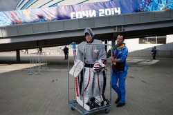 teuvoteravainens:  Team Switzerland’s hockey goaltender Florence Schelling being wheeled in a luggage cart while in full gear.  There are no dressing rooms at the practice rink, so teams must walk (or be wheeled) back and forth from their dressing rooms