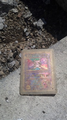 damnguido:  sean3116:  Lost in the cracks of my house’s front porch over a decade ago and unearthed today by a construction project, this “Ancient Mew” card now fully looks the part. Now 22 years old, I am very pleased to have it returned to me,