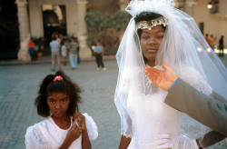 unrar:    A Cuban woman on her wedding day to an Italian man, Havana, 1996, David Alan Harvey. 