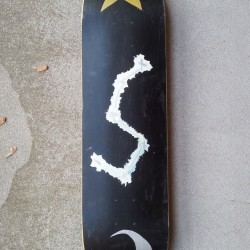 Space type skateboard deck bottom. There&rsquo;s a star and a moon in addition to the dipper.