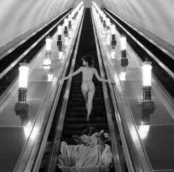 sir-j:  A woman is captured climbing the escalator on the Moscow Underground in 1989