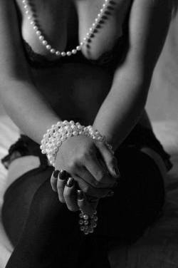 Ropes, Chains, Shackles. All are viable. Tie her up in her own pearls. I assure you this is an exquisite method. Mental torture and physical restraint combined. On one hand, they might be easy to get out of, on the other hand if she pulls too hard her