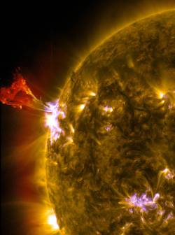 asapscience:  A solar flare, captured by NASA.If you consider that Earth’s circumference is 40,075km and that the Sun’s is 4,366,813km, the surface area of this one flare is, well, a lot bigger than the Earth.  via Reddit 