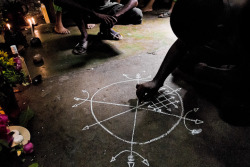 barringtonsmiles:  Cuban man and Palo Mayombe practitioner draws patimpemba (magical symbols similar to sigils, used to invoke spirits/energies) on the floor. Photography by Jan Sochor 