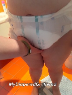 mydiaperedgirlfriend:  Feeling her very wet diaper. She normally only wet the back the most. Now the whole diaper was soaked