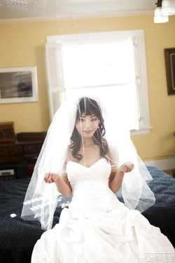 passionatelove-ak:  Sexy Asian bride Marica Hase removing wedding dress for nude photo