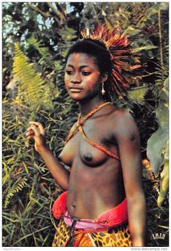   Malian woman, via Delcampe.  