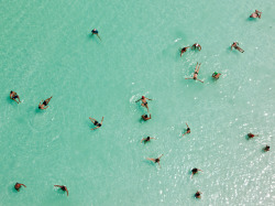    Dead Sea, Israel Photograph by George Steinmetz, National GeographicSwimmers float effortlessly in the salt-laden waters of the Dead Sea near Ein Bokek, Israel. Ten times saltier than seawater, the lake is extremely buoyant and a popular destination