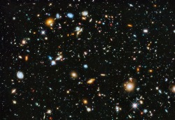 jtotheizzoe:  Hubble Goes Deep Do not adjust your screen. Before you stands a portal connecting us to the universe as it was just a few hundred million years after The Big Bang. NASA has released an updated version of the iconic Hubble Deep Field for