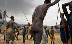   Ethiopia’s Omo Valley, by Olson and Farlow    After the Donga (stick fight), men lean on their penis-shaped sticks and it becomes a social event.  