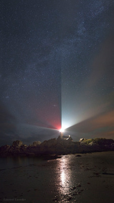 wavesoftware:  Universe Beyond our Civilization  The night sky meets with bright rays of a lighthouse at the coast of Brittany, France. The Milky Way in Cassiopeia and Cygnus appears in the sky. Our neighbor galaxy, M31, known as the Andromeda Galaxy,