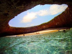 lunaduran:  atlasobscura:  Hidden Beach - Mexico A gaping hole in the surface of the lush green island exposes a secret beach, with ample shade, sun and crystal-clear water. The Marieta Islands are an archipelago, a chain of islands that exist as a result