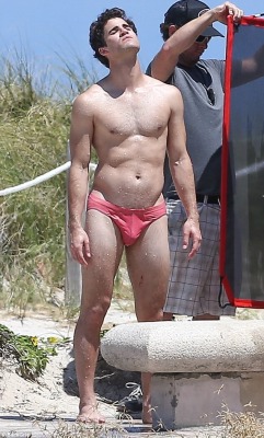 celebritybodybuge:  Darren Criss Part 1 Darren Criss in a red speedo as Andrew Cunanan on the set of The Assassination of Gianni Versace; American Crime Story.