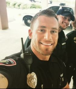 I suddenly feel the need to break the law so Mr. Hot Cop and his cute cop friend behind him can strip search me and force me to worship their cocks! BF material!
