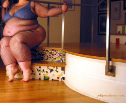 thegoldenboy2050:  Her pose is as playful as the mosaic stairs upon which she sits. 