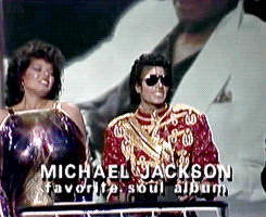 Michael Jackson accepts an AMA, as Angela Bowfill tries to keep her shit together behind him because he’d just kissed her on the cheek. 