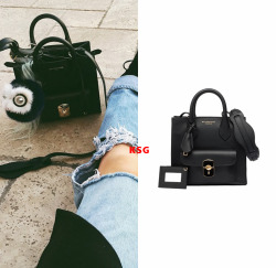 kyliestyleguide:  Kylie Jenner wearing a Balenciaga Padlock Mini All Afternoon Bag for ũ,695. Buy it HERE. Shes also wearing Sorella Boutique Jeans and Fendi Bag Charm.