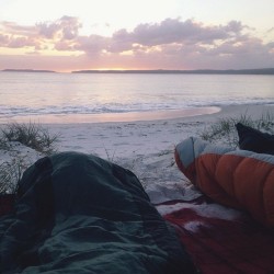 midnxght:  unrisked:  fastallein:  sleeping on the beach  Wow  want  What a great way to wake up.   Waking up with someone you love cuddled next to and a hot cup of coffee would make it just that much better.