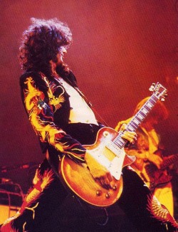 rocknrollhighskool:  Led Zeppelin’s Jimmy Page in his famous dragon suit, on stage in 1975  Mr Page