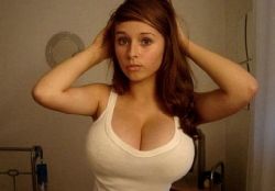 minxyjunkie:  Whether she’s half their age or a couple years older, she sight of her tits stuffed into a little white tank top has the same effect on every guy.  Any girl with big breasts elicits the same reaction in an outfit like that.  Tight white