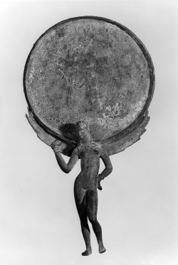 ancientart: Ancient Etruscan Mirror with Female Figure and Engraved Scene, bronze, 3rd century BC.  The handle of this mirror is cast as a female figure with bracelets, armband, and necklace. She holds an object in her right hand, her arm is bent, and