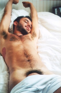Scruffy hairy boy waking up in the morning.