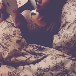 My lady reading her Tumblr in bed.