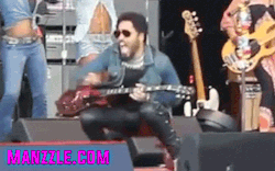 newmanzzle:  Lenny Kravitz on August 3, 2015 while preforming in Sweden his pants broke and he was literally “rocking out” with no underwear. No, that is not a cock ring. Lenny has a piercing at the top base of his penis. 