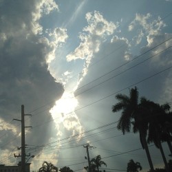 2 beautiful clouds closing in on the sun â˜º #pretty #sunset #miami #sun #clouds #day #night #sunrays
