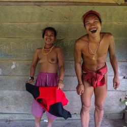 elephantguncollective:  “The government and missionaries want us to wear clothes, but I’m a Mentawai  warrior-this is my wife-if you want to take pictures, she will take off her shirt, because people have to see how Mentawai really lives.” Hold