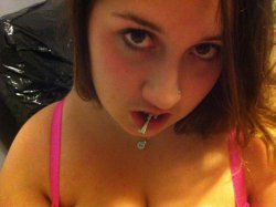 Liz704 shows off her tongue piercing
