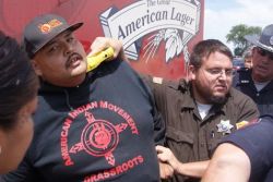 nellymirikitani:  fuck-the-conquistadores:  katfiercefeather:  his-name-is-nightrider:  ‘”This cop is holding a taser to the neck of a Lakota man blocking the passage of a beer truck in White Clay, Nebraska. Despite police violence, the action was