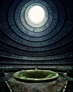 sixpenceee:  Abandoned Cooling Tower located in Monceau, Belgium. While in use, the tower cooled incoming hot water by using wind. The wind would enter the opening at the bottom of the tower and rise up, cooling the hot water. The air would then become