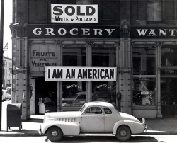 A grocery store at the time its Japanese-American owner is evicted. Oakland, CA, 1942. Photograph by Dorothea Lange.