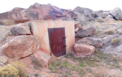 armedplatypus:  cerebralzero:  everythingsks:  Abandoned bunker found outside of Zion’s Canyon Utah. No idea what it was used for and there are several in the area like this. Rusted shut and locked. I like to think they’re weapon caches.  Zion Canyon