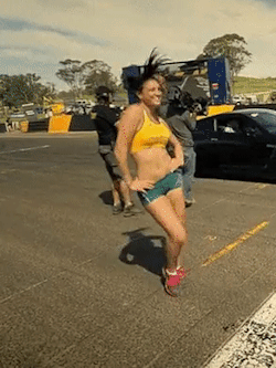   Michelle Jenneke bouncing at race track  