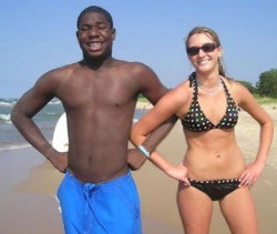 teen-interracial:  These two beach buddies are getting along nicely. Interracial relationships are very popular with teens these days.