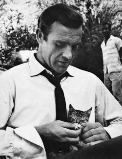  Sean Connery playing with a kitten on the set of Dr. No, 1962  