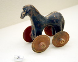 coolartefact:  Ceramic toy horse on wheels. Protogeometric (ca. 900 BCE), Greece. Found in a child’s grave. Kerameikos Museum, Athens Source: https://imgur.com/Jr1F7KC