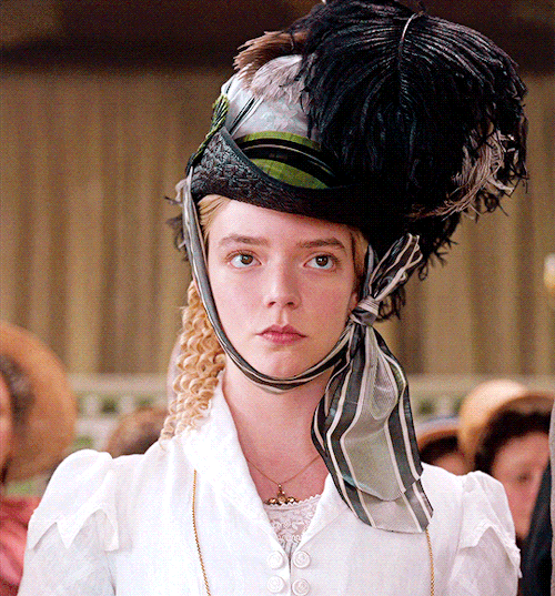 frodo-sam: Emma’s white pelisse worn with a black hat with feathers and a green bow  (requested by anonymous).EMMA. (2020) dir. Autumn de WildeCostume design by Alexandra Byrne.