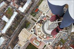 99percentinvisible:  Russian climber Kirill Oreshkin climbs to the top of tall buildings and takes photos with a wide-angle lens.  totally crazy but so nice !!