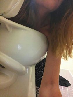 naughty-redhead:  Cooling my sunburned tits off in the office toilet. 