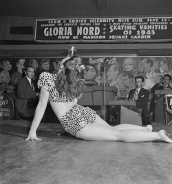 kvetchlandia:  Roman Vishniac     Burlesque Dancer Balancing a Glass on Her Head, Leon &amp; Eddie’s, 52nd Street, New York City      1945 