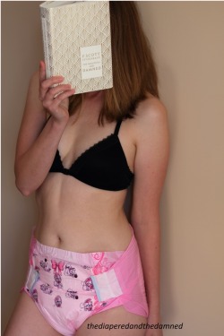 thediaperedandthedamned:  Lola enjoying our namesake book.  Also her @diaper-connoisseur Amors