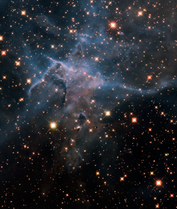 astronomicalwonders:  The Mystic Mountain - HH 901 This is a NASA Hubble Space Telescope near-infrared-light image of a three-light-year-tall pillar of gas and dust that is being eaten away by the brilliant light from nearby stars in the tempestuous stell