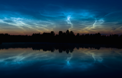 nubbsgalore:  noctilucent clouds, also known as night shinning clouds, can be seen when illuminated by the setting sun as it drops bellow the horizon. found high in the mesosphere, near the edge of space, the clouds consist of tiny ice crystals about