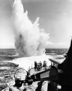 USS Philip (DDE-498) Depth charge explodes astern, during operations off the Hawaiian Islands, 28 May 1957
