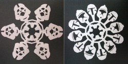 thedailywhat:  Papercraft of the Day: Ethan was busy constructing a Stormtrooper-shaped paper snowflake, when his mom spotted his artwork and decided to make a few Star Wars-themed snowflakes of her own. Showoff. [neatorama.] 