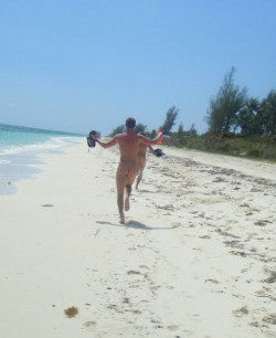 Best way to enjoy the beach - running naked after your mate, down the sand !!
