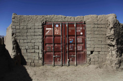 “A door made from a shipping container marks the entrance to a compound at the village of Kunkak in southern Afghanistan’s Helmand province.” Image from The Toronto Star’s Doors to Afghanistan slideshow. Photo: Finbarr O’Reilly/Reuters. 
